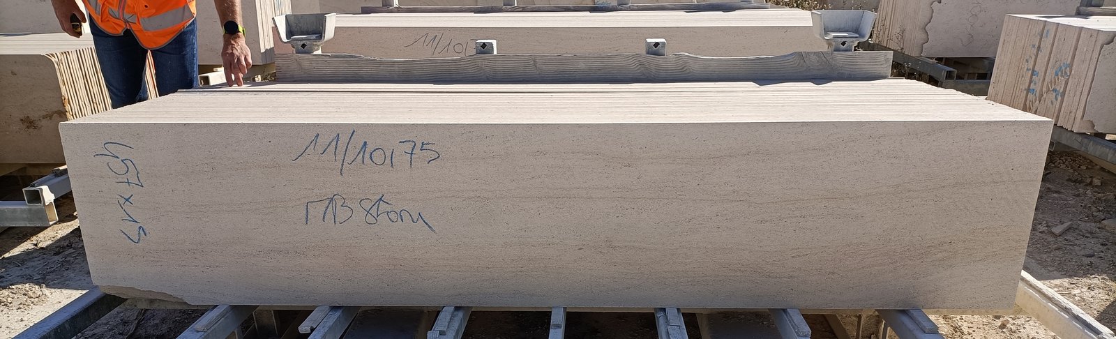 Limestone block on a steel rack in a stone yard